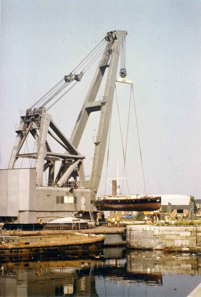Pyronaut being lifted out of the water by a large grey crane.