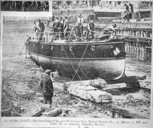 A black and white newspaper clipping showing Pyronaut being pulled on shore by ropes. Several men stand on the deck and one observes from the ground. 